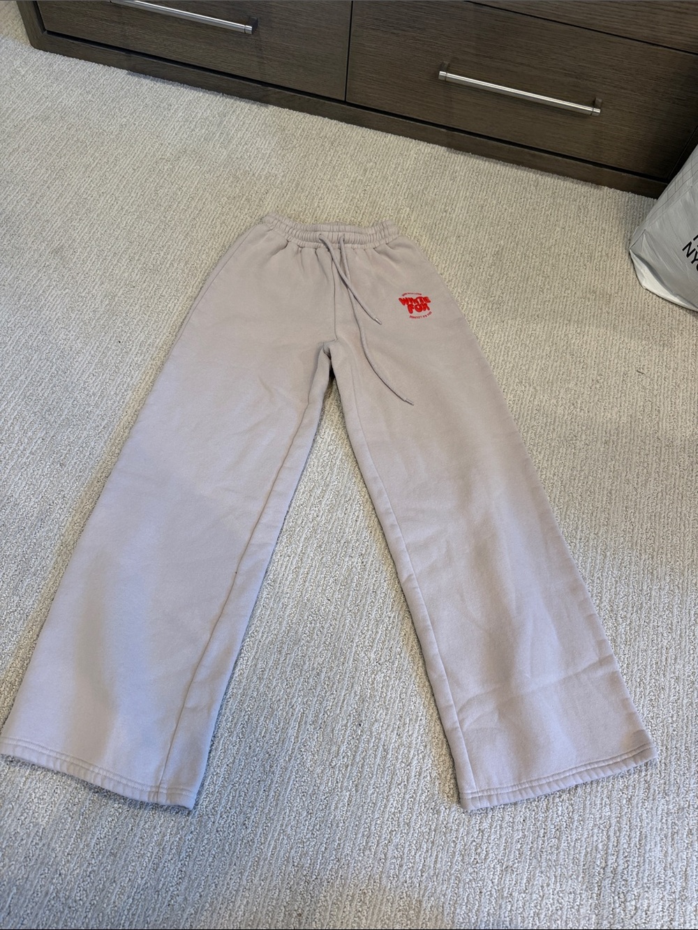 White Fox Boutique Wide Leg Sweatpants in Light Beige with Red Logo